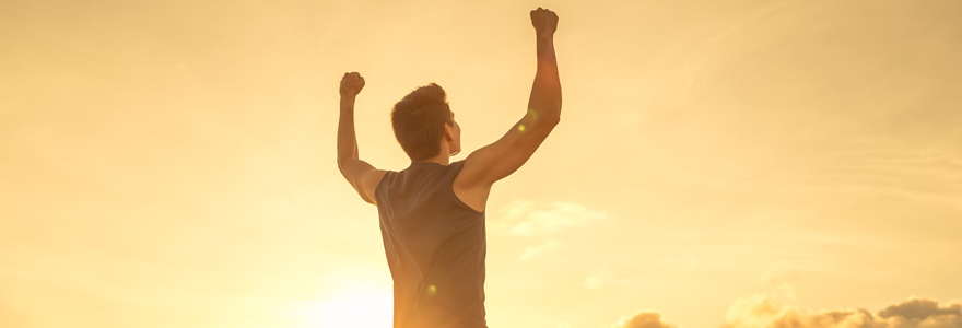 Strong,Fit,Young,Man,Raising,Fist,Up,The,Sunset,Sky.