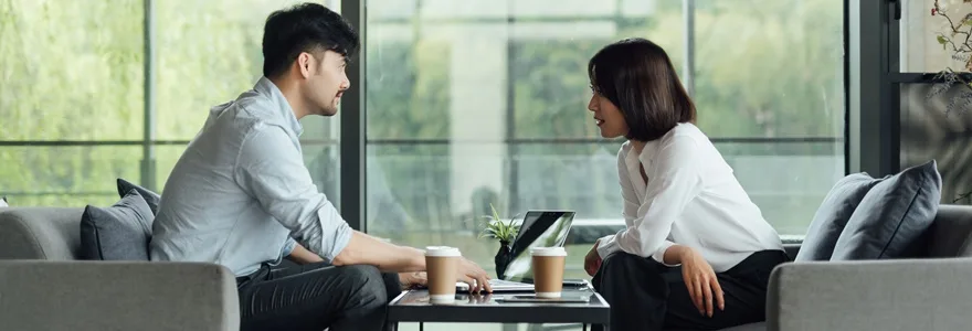 Two,Young,Asian,Business,Men,And,Women,Are,Working