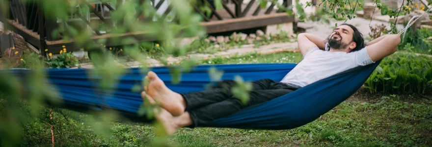 A,Man,Is,Resting,In,A,Hammock,In,A,Country