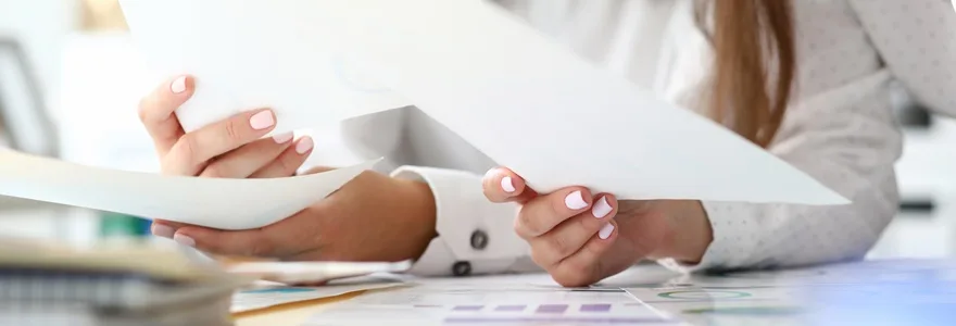 Focus,On,Tender,Female,Hands,Holding,Important,Business,Documents,With