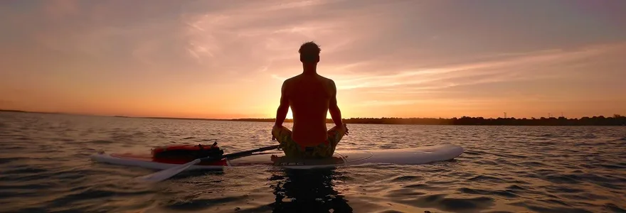 Paddle,Boarder,Enjoying,The,Sunset,In,A,Meditative,Posture,In