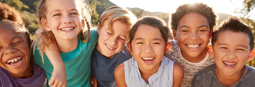 Portrait,Of,Multi-cultural,Children,Hanging,Out,With,Friends,In,Countryside