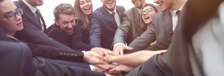 Large,Group,Of,Business,People,Standing,With,Folded,Hands,Together
