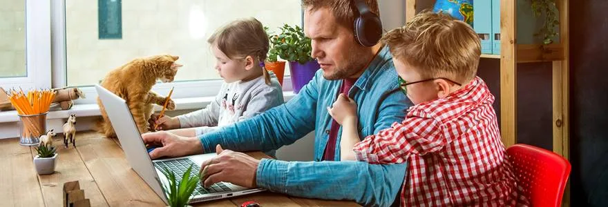 Work,From,Home.,Man,Works,On,Laptop,With,Children,Playing